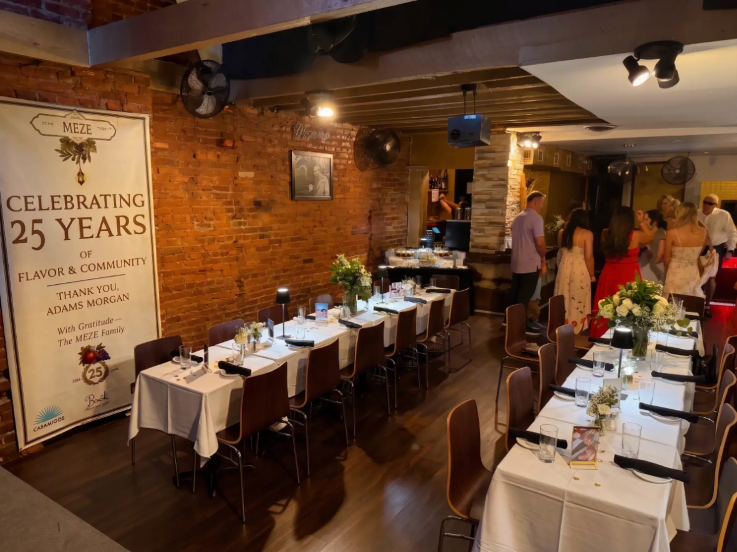 Family-style wedding feast set across the table