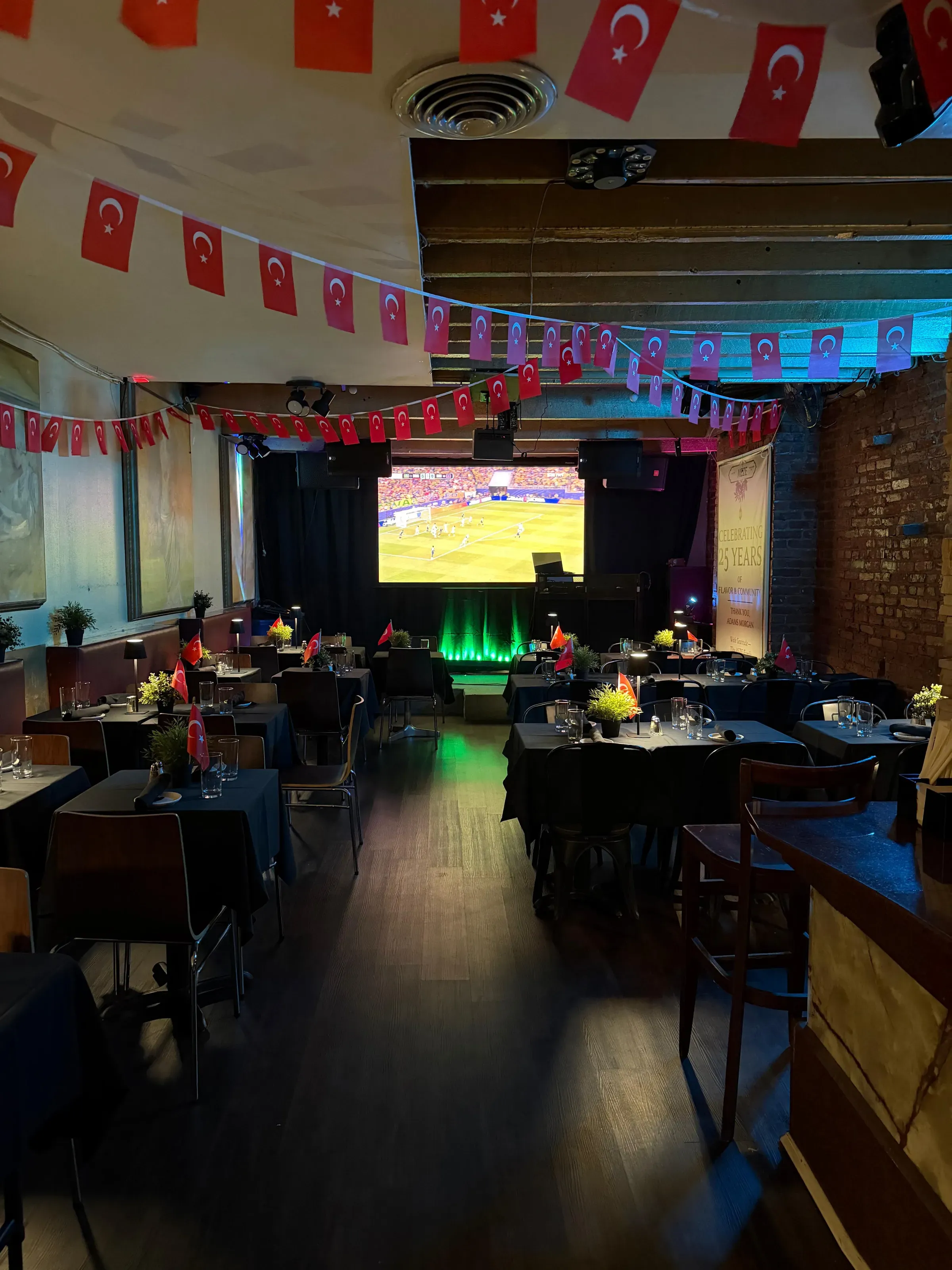 Game-day crowd cheering at Mezè DC